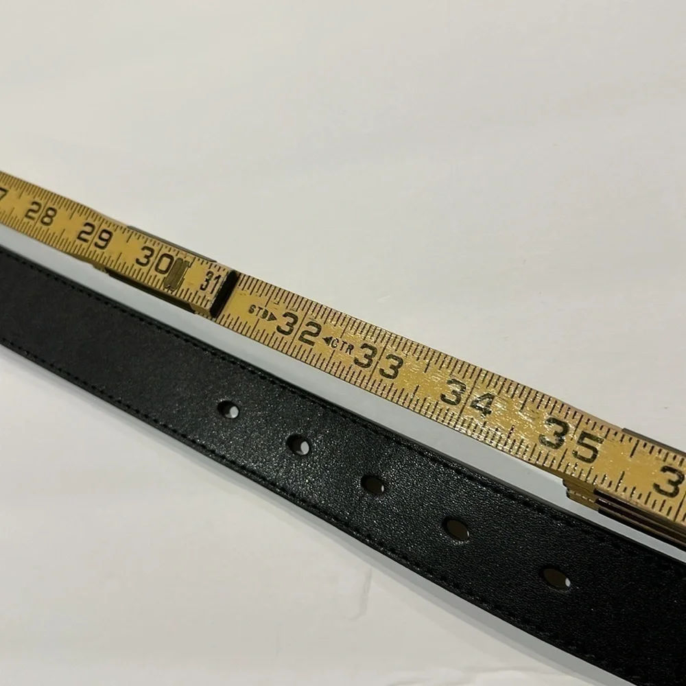 Black Vegan leather belt with silver tone buckle fits approximately 31-36”